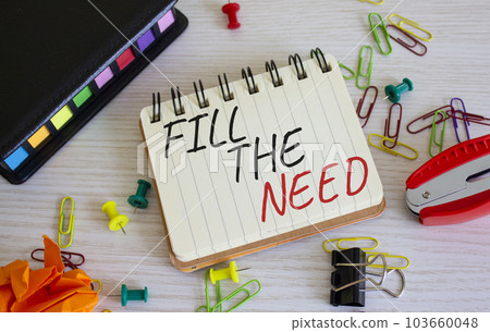 Fill the need symbol. Concept word Fill the need on white notebook. Beautiful wooden background. Business and Fill the need concept. Copy space 103660048