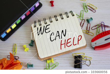 We can help symbol. Concept words We can help on white notebook. Beautiful wooden background. Business and We can help concept. Copy space. 103660056