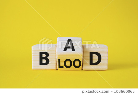 Breed Bad Blood symbol. Wooden cubes with words Breed Bad Blood. Beautiful yellow background. Breed Bad Blood and business concept. Copy space 103660063