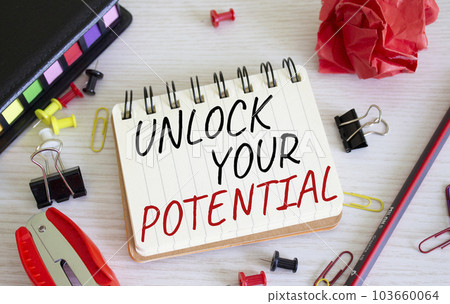 Unlock your Potential symbol. Concept words Unlock your Potential on white notebook. Beautiful wooden background. Business and Unlock your Potential concept. Copy space. Unlock your Potential symbol. Concept words Unlock your Potential on white notebook. Beautiful wooden background. Business and Unlock your Potential concept. Copy space. 103660064