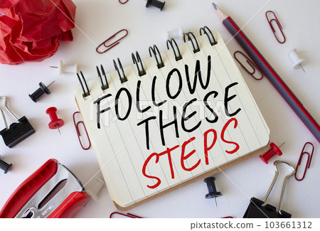 Follow these steps symbol. Concept words Follow these steps on white notebook. Beautiful white background. Business and Follow these steps concept. Copy space. 103661312