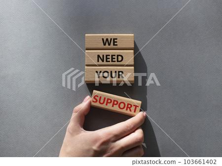 We need your support symbol. Wooden blocks with words We need your support. Beautiful grey background. Businessman hand. Business and We need your support concept. Copy space. 103661402