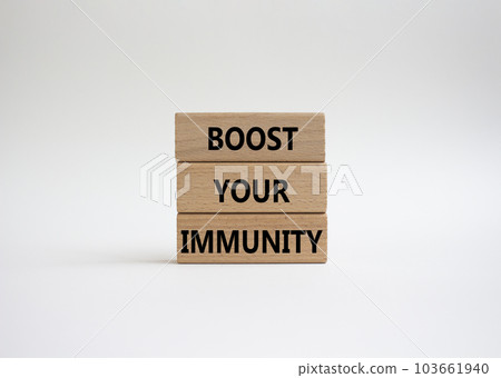 Boost your immunity symbol. Concept word Boost your immunity on wooden blocks. Beautiful white background. Helthcare and Boost your immunity concept. Copy space 103661940