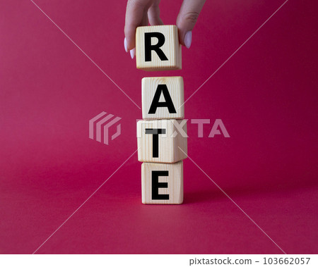 Rate symbol. Concept word Rate on wooden cubes. Businessman hand. Beautiful red background. Business and Rate concept. Copy space. 103662057