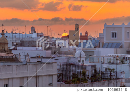 Picturesque sunset over the rooftops of Spanish Cadiz. 103663348