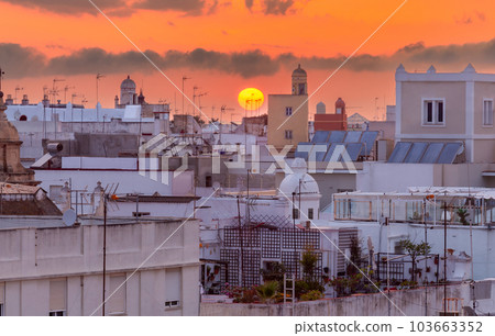Picturesque sunset over the rooftops of Spanish Cadiz. 103663352
