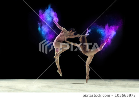 Passion. Young graceful ballet dancers, man and woman ion beige bodysuits dancing with powder explosion against black studio background 103663972