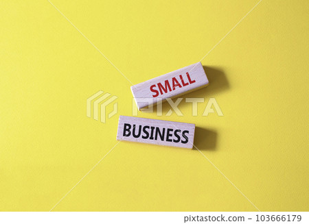 Small business symbol. Concept words Small business on wooden blocks. Beautiful yellow background. Business and Small business concept. Copy space. Small business symbol. Concept words Small business on wooden blocks. Beautiful yellow background. Business and Small business concept. Copy space. 103666179
