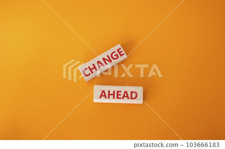 Change ahead symbol. Wooden blocks with words Change ahead. Beautiful orange background. Business and Change ahead concept. Copy space. Change ahead symbol. Wooden blocks with words Change ahead. Beautiful orange background. Business and Change ahead concept. Copy space. 103666183