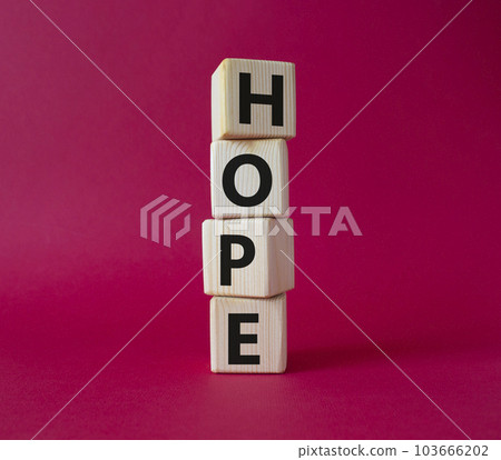 Hope symbol. Concept word Hope on wooden cubes. Beautiful red background. Business and Hope concept. Copy space. 103666202