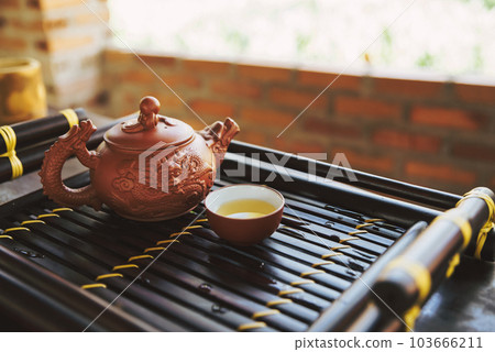 Tea set a wooden table for tea ceremony background Tea set a wooden table for tea ceremony background 103666211