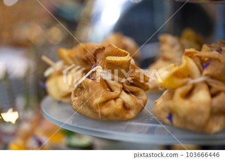 pancake bag with filling on the buffet table with snacks pancake bag with filling on the buffet table with snacks 103666446