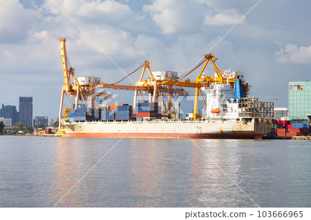 Cargo ship at dock with sky background. Cargo ship at dock with sky background. 103666965