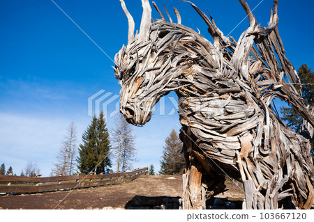 Wooden sculpture of a dragon. Italian landmark 103667120