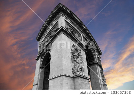 Arc de Triomphe (against the background of sky with clouds), Paris, France. The walls of the arch are engraved with the names of 128 battles and names of 660 French military leaders (in French) Arc de Triomphe (against the background of sky with clouds), Paris, France. The walls of the arch are engraved with the names of 128 battles and names of 660 French military leaders (in French) 103667398