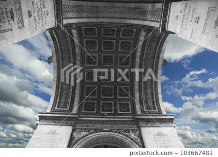 Arc de Triomphe (against the background of sky with clouds), Paris, France. The walls of the arch are engraved with the names of 128 battles and names of 660 French military leaders (in French) 103667481
