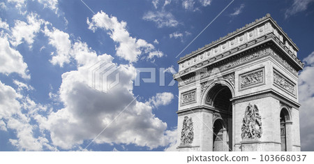 Arc de Triomphe (against the background of sky with clouds), Paris, France. The walls of the arch are engraved with the names of 128 battles and names of 660 French military leaders (in French) 103668037