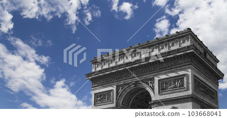 Arc de Triomphe (against the background of sky with clouds), Paris, France. The walls of the arch are engraved with the names of 128 battles and names of 660 French military leaders (in French) 103668041