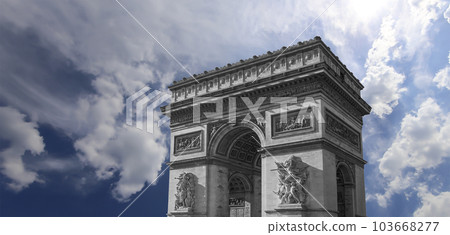 Arc de Triomphe (against the background of sky with clouds), Paris, France. The walls of the arch are engraved with the names of 128 battles and names of 660 French military leaders (in French) Arc de Triomphe (against the background of sky with clouds), Paris, France. The walls of the arch are engraved with the names of 128 battles and names of 660 French military leaders (in French) 103668277