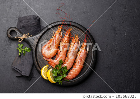 Fresh seafood. Board with langoustines Fresh seafood. Board with langoustines 103668325