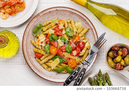 Italian pasta adorned with fresh tomatoes and aromatic basil Italian pasta adorned with fresh tomatoes and aromatic basil 103668738