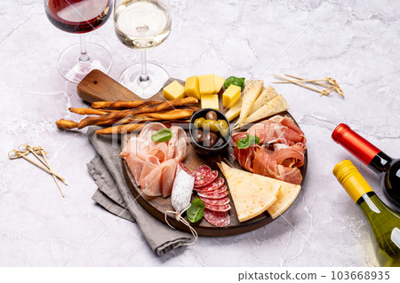 Antipasto board with meat and cheese snacks 103668935