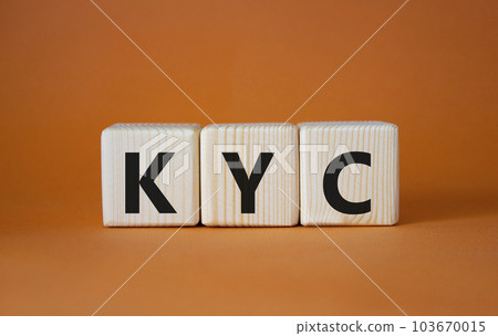 KYC - Know Your Customer. Wooden cubes with word KYC. Beautiful orange background. Business and Know Your Customer concept. Copy space. 103670015