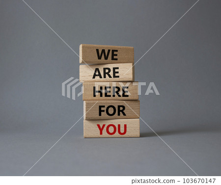 Help symbol. Wooden blocks with words We are here for you. Beautiful grey background. Business and We are here for you concept. Copy space. 103670147
