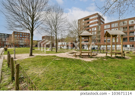 an empty park in front of the apartment buildings at camden place apartments in baltimore, md on april 29, 2018 103671114