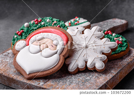 Beautiful colored Christmas gingerbread cookies for the design and decoration Beautiful colored Christmas gingerbread cookies for the design and decoration 103672200