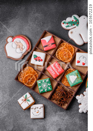 Beautiful colored Christmas gingerbread cookies for the design and decoration Beautiful colored Christmas gingerbread cookies for the design and decoration 103672219