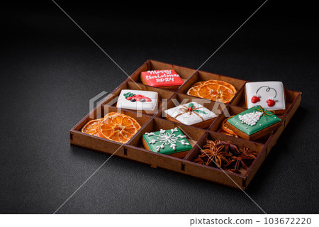 Beautiful colored Christmas gingerbread cookies for the design and decoration Beautiful colored Christmas gingerbread cookies for the design and decoration 103672220