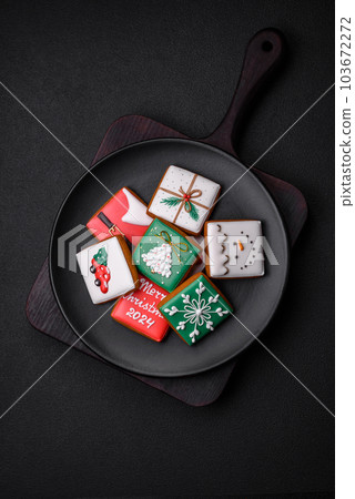 Beautiful colored Christmas gingerbread cookies for the design and decoration 103672272