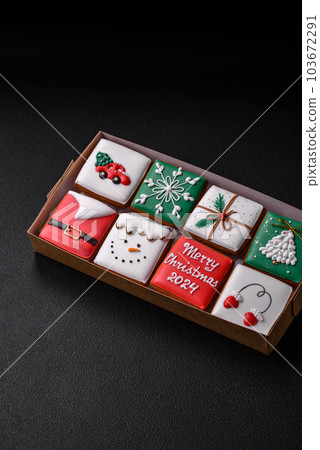 Beautiful colored Christmas gingerbread cookies for the design and decoration Beautiful colored Christmas gingerbread cookies for the design and decoration 103672291