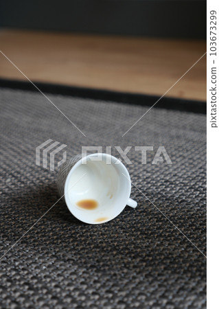 cup of coffee spilled on gray color carpet cup of coffee spilled on gray color carpet 103673299