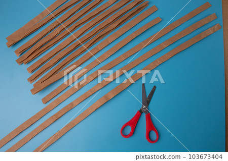 fold a strip of paper in half lengthwise fold a strip of paper in half lengthwise 103673404