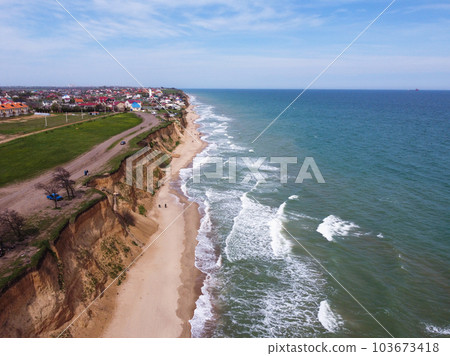 Empty sunny summer sand beach with clear sea water. Empty sunny summer sand beach with clear sea water. 103673418