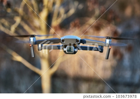 Drone flying outdoors Drone flying outdoors 103673978