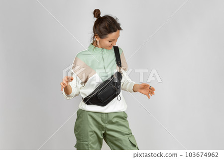 Woman with Black Leather Crossbody Fanny Pack Bag Woman with Black Leather Crossbody Fanny Pack Bag 103674962