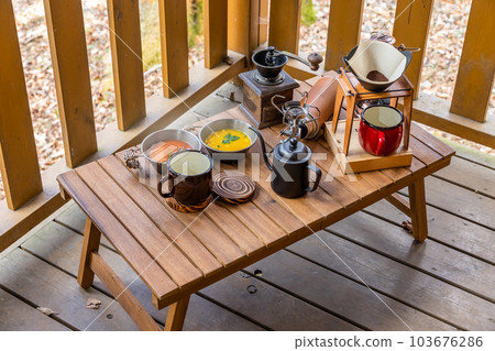 Cooking food using a bonfire at the campsit 103676286