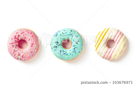Three different color donuts top view on white background Three different color donuts top view on white background 103676971