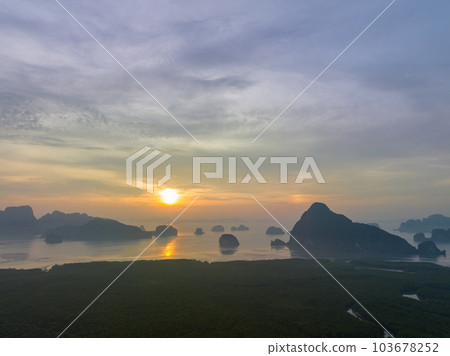aerial view Amazing light of nature cloudscape sky above Samed Nang Chee Phang Nga archipelago. .Imagine a fantasy bright red sky at sunrise from a bird's eye view..tropical landscape background. 103678252