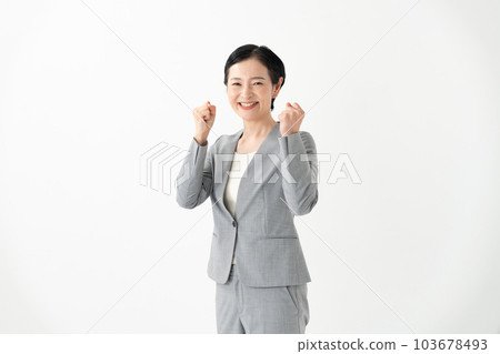 A woman doing a fist pose in a suit 103678493