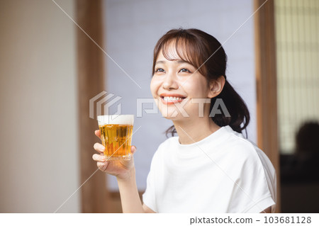 Woman drinking beer Woman drinking beer 103681128