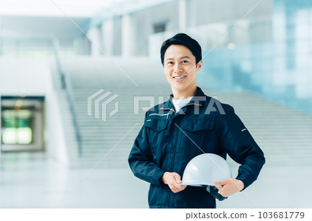 middle worker with helmet 103681779