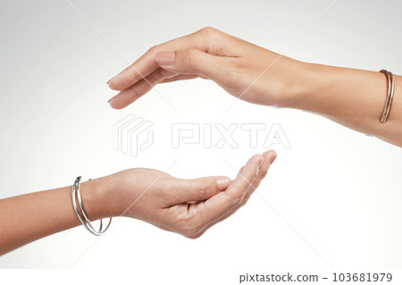 Support is a give and take. Cropped shot of two unrecognizable women posing with their hands cupped above each other. 103681979