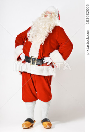 Christmas, holiday and santa man in suit for festive, happy and cheerful celebration marketing. Traditional santa claus full body with studio mockup and white background for advertising. 103682006