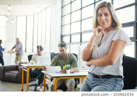 Creative business woman, smile and arms crossed thinking of idea in leadership or management at office. Portrait of young confident female designer standing in thought for career startup at workplace Creative business woman, smile and arms crossed thinking of idea in leadership or management at office. Portrait of young confident female designer standing in thought for career startup at workplace 103682056