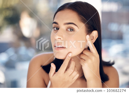 Beauty, acne and face of woman with skincare hygiene, routine and grooming check with concern. Aesthetic, thinking and facial girl feeling skin texture from pimple cosmetic treatment. 103682274