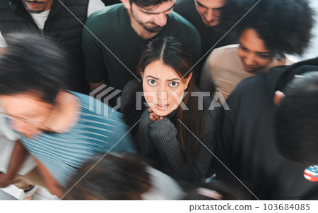 These clouds theyre seeing, theyre explosions in the sky. Shot of a young woman experiencing mental illness while being surrounded by people inside. 103684085